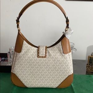 Michael Kors hobo bag with beautiful belt latch.